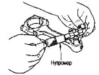 Measure the inside diameter of the connecting rod small end bushing using a bore gauge.