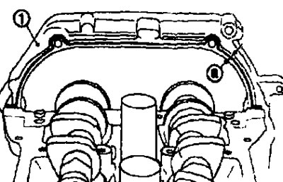 II. Нанесите герметик на контактную поверхность под кронштейн (№1) распредвалов с обратной стороны…